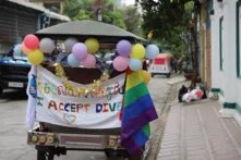 A Pride tuk-tuk and participants of the Pride race in front of hbs office.