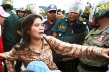 Tep Vanny blocked by riot police during protest. Vanny is one of 7 sentenced (VOA)