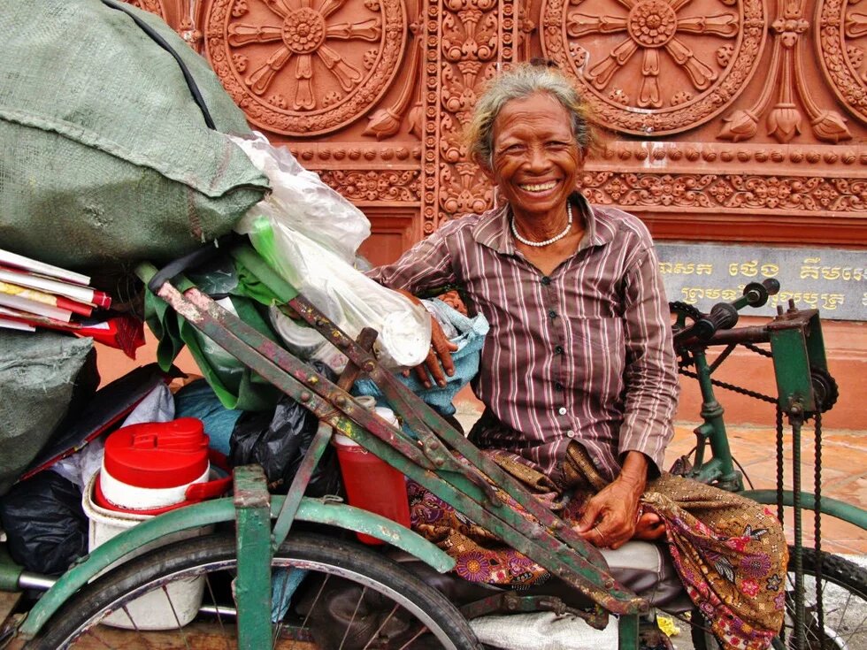 A female informal street waste picker, known as Edjaj in Khmer language A female informal street waste picker, known as Edjaj in Khmer language