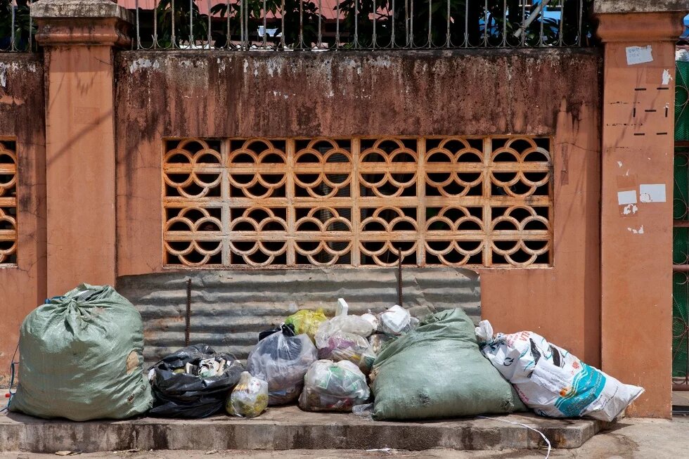 Garbage bags in front of a house in Siem Riep, Cambodia 