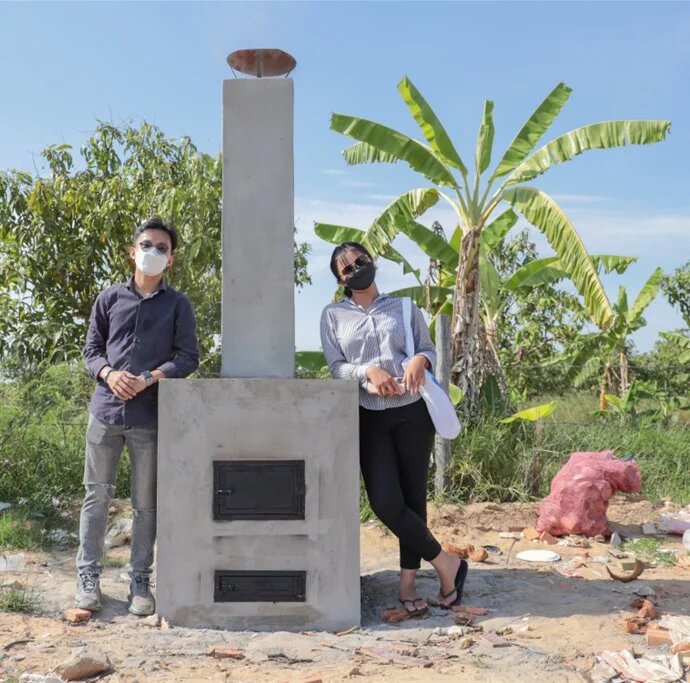 The Cambodia Green Will team pose with their trash incinerator prototype.