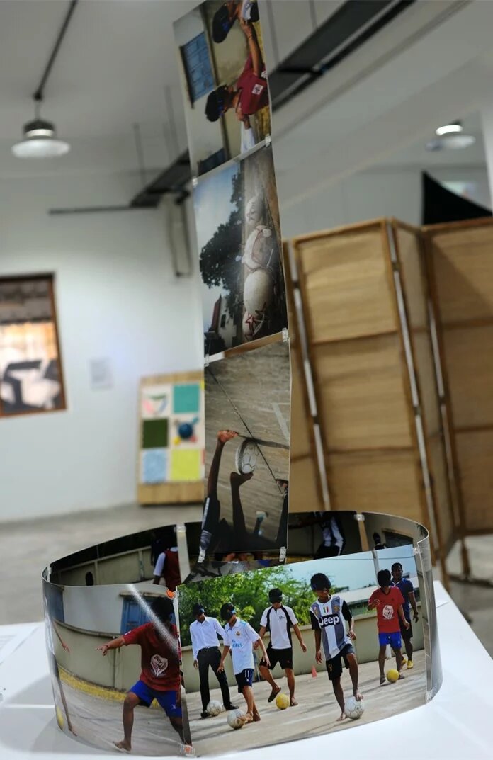 Series of photographs at the exhibition focusing on a football program by ISF Cambodia involving blind teenagers. 